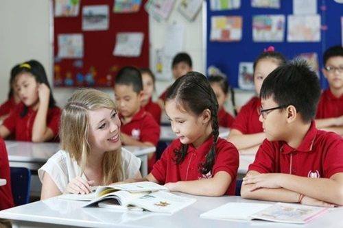 Teacher working with students in a classroom