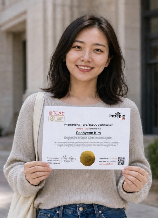 Woman holding an IntrepidTEFL certificate